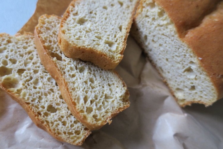 Thick slices of homemade keto bread with an open, airy crumb