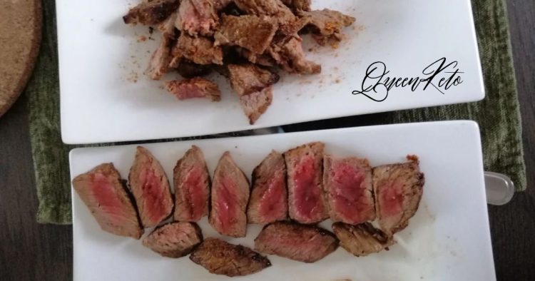 Two plates of seared steak, one sliced medium rare and one cut into crispy strips